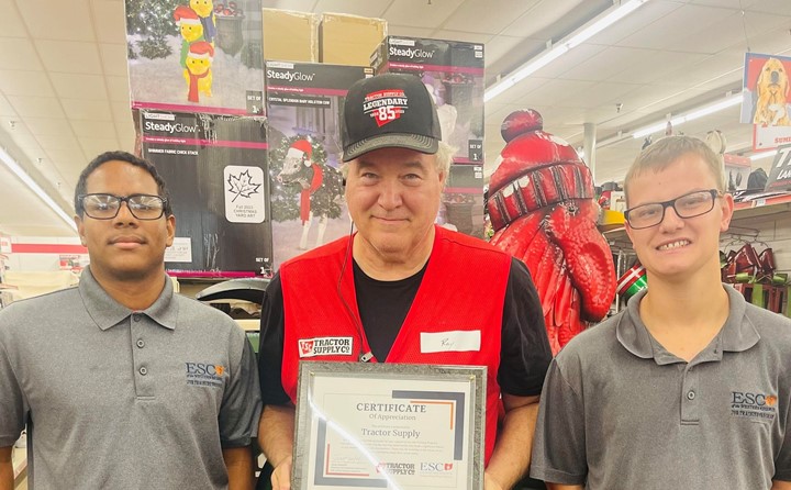 Job Training students present a plaque of appreciation at Tractor Supply in Middlefield Ohio. 