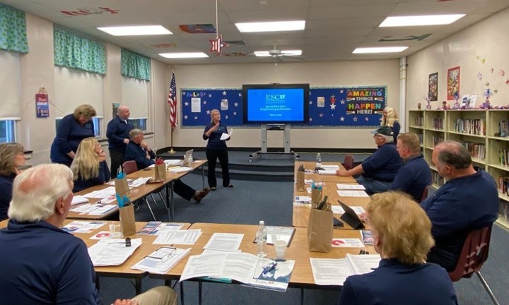 Keeping our board informed! Our program administrators provide updates to our governing board members at the May 9th board meeting. 
